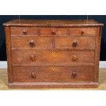 A George III oak chest, of three small, two short and two long drawers, 85cm high, 122cm wide, 54.