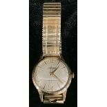 A 9ct gold Accurist 21 jewel wristwatch, champagne dial, gold plated strap