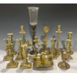 A pair of Victorian brass ejector candlesticks, 18cm high; others similar, 19th century and later,