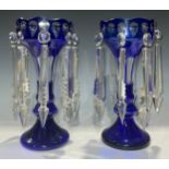 A pair of late 19th century Bohemian blue flashed lustres, prismatic cut glass droplets, 30cm