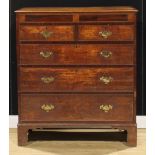 A George III oak and mahogany chest, of two short and three long graduated drawers, bracket feet,