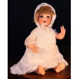 A Heubach Koppelsdorf (Germany) bisque head and painted composition bodied doll, the bisque head