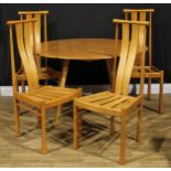 An Ercol beech and elm drop-leaf dining table, 71.5cm high, 63cm opening to 124.5cm long, 113.5cm