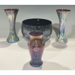 An Okra iridescent studio glass trumpet shaped vase, 19cm; another similar; a 20th century