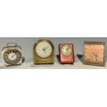 A Cyma Art Deco clock; a Europa musical alarm; an Inventic alarm; another (4)