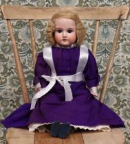 An Armand & Marseille (Germany) bisque shoulder head doll, the bisque head with weighted sleeping