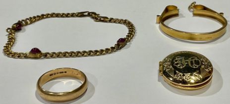 A 9ct gold wedding band, size Q, 3.16g; a 9ct gold coin mount, 4.2g; a 9ct gold and ruby bracelet,