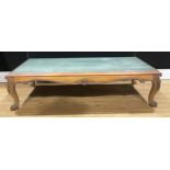 A ‘Victorian’ rosewood low sitting room table, stone top, a later construction incorporating some