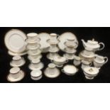 A Royal Doulton Royal Gold part dinner and tea service, comprising teapot, cake plates, dinner