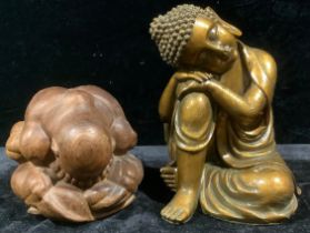 A carved hardwood figure, Weeping Buddha, 14cm high; another, resin model, of a seated Buddha (2)