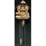 A Black Forest musical cuckoo clock, by Schneider, three weights, pendulum, instructions
