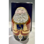 A Royal Crown Derby paperweight, Santa Claus, in the form of a Russian doll, red robe with gold