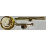 An Edwardian gold coloured metal bar brooch, probably 14ct, set with aquamarine, 4.1g; a 9ct gold