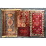 A Middle Eastern rectangular woollen rug or carpet, stylised geometric floral motifs, in tones of