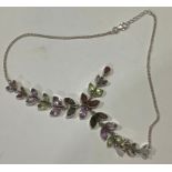 A silver and multi gemstone necklace, set with navette and pear shaped garnets, amethyst, and