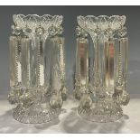 A pair of clear glass lustres, alternating prismatic and hammer droplets, 28cm