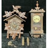 A Vienna style musical wall clock, of small proportions, 52cm high; a Black Forest cuckoo clock (2)