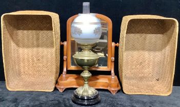 A Victorian mahogany dressing mirror; a brass oil lamp; two log baskets (4)