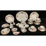 A Royal Crown Derby Posies pattern tea set for six, three milk jugs and sugar bowls, salt and pepper