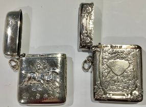 AN Edward VII silver vesta case, engraved with ivy, vacant cartouche, 5cm, Birmingham 1909; a