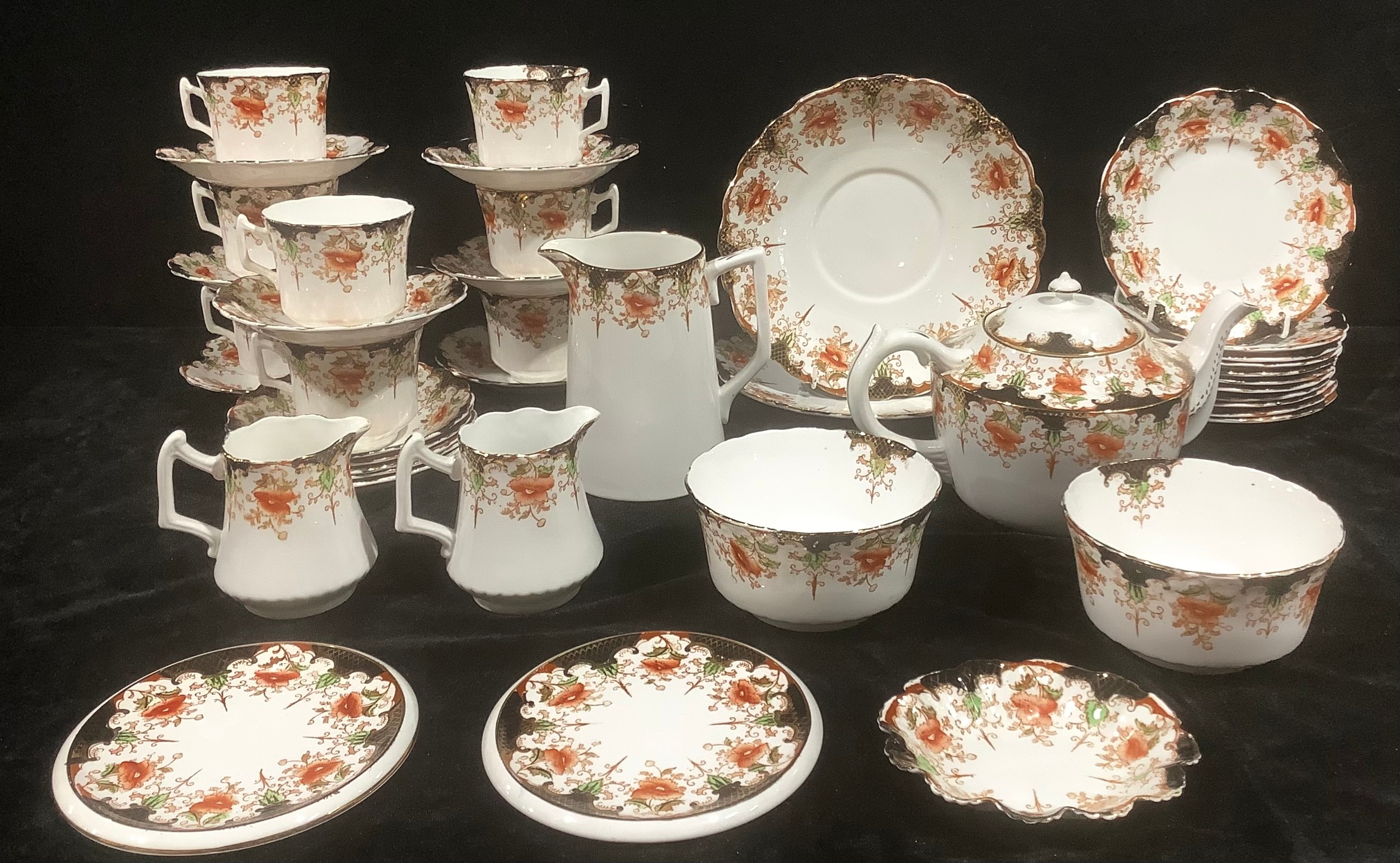 An Edwardian Wellington China part tea service, Alton pattern, comprising teapot and stand, water