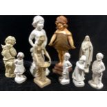 A large moulded plaster figure, curly haired girl, 58cm; others, Nenette and Toto; Virgin Mary;