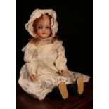 A Simon & Halbig (Germany) bisque head and ball jointed painted composition bodied doll, the