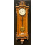 A late Victorian walnut and parcel-ebonised Vienna wall clock, 120cm high, 40cm wide