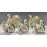 A Royal Crown Derby paperweight family group, The Royal Swans and Cygnets, William and Kate, George,
