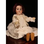 An Armand & Marseille (Germany) bisque head and ball jointed painted composition bodied doll, the