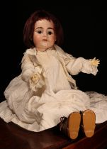 An Armand & Marseille (Germany) bisque head and ball jointed painted composition bodied doll, the