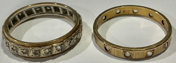 A 9ct gold eternity ring, set with diamond chips; another similar; 4.5g