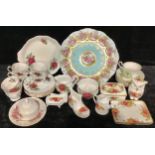A Royal Albert tea set for six, printed with red roses, milk jug and sugar bowl, sandwich plate; a