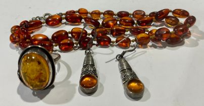 Amber - Victorian amber beads; silver and amber earrings; a silver and amber ring