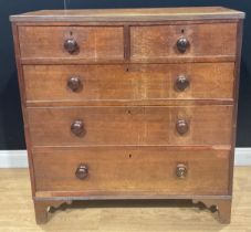 A George III oak chest, of two short and three long graduated drawers, 103.5cm high, 99.5cm wide,