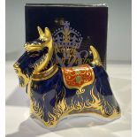 A Royal Crown Derby paperweight, Scottish Terrier, 14cm long, gold stopper, 14cm long, printed