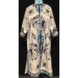 Textiles - a Japanese white silk kimono, embroidered in black with roundels of Geisha in garden