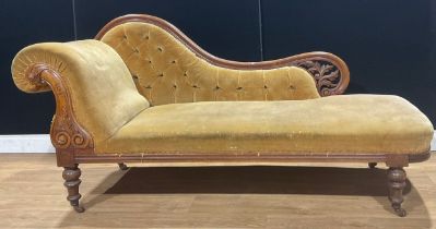 A Victorian walnut and mahogany chaise longue, deep-button back, stuffed-over upholstery, 90.5cm