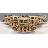 A set of six Royal Crown Derby 1128 Imari pattern coffee cans and stands, first quality