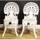 Garden Furniture - a pair of 'Coalbrookdale' style painted cast aluminum garden chairs, each pierced