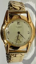 An 18k gold gentleman's watch, Universal Genève, Champagne dial, Arabic numerals to quarters,