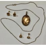 A 9ct gold locket and chain; a pair of 9ct gold earrings; another pair; 11g gross