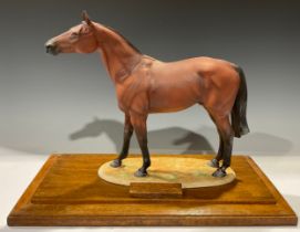 An Albany porcelain model of Red Rum, wooden plinth base, 41.5cm high, 52cm wide