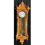 A late 19th/early 20th century walnut Vienna wall clock, 125cm high