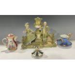 A 19th century German porcelain chocolate jug and cover, painted with panels of courting couples and