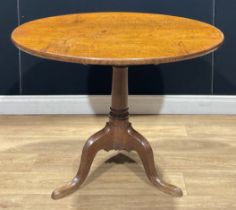 A George III oak tripod occasional table, 68cm high, the top 88.5cm diameter