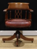 An early 20th century mahogany swivel desk chair, by Cooke’s (Finsbury) Ltd, badged, 83cm high, 61cm