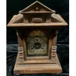 An early 20th century Junghans oak architectural mantle clock, eight-day movement, brass and
