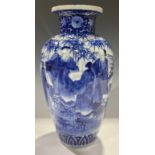 A Japanese Meiji ovoid vase, decorated in underglaze blue with scholars amongst bamboo, 34.5cm high