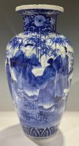 A Japanese Meiji ovoid vase, decorated in underglaze blue with scholars amongst bamboo, 34.5cm high